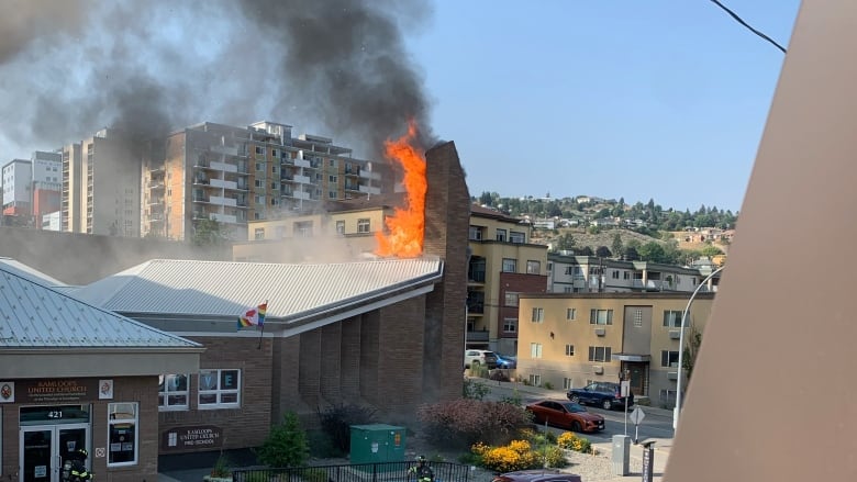 Flames are seen coming from the Kamloops United Church.