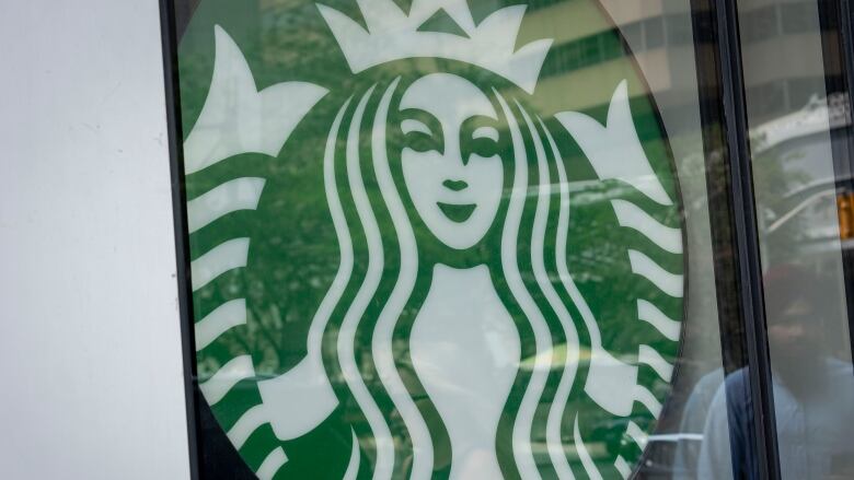 The green Starbucks logo, which depicts a mermaid with a crown.