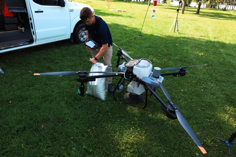 boy fills large drone with chemicals