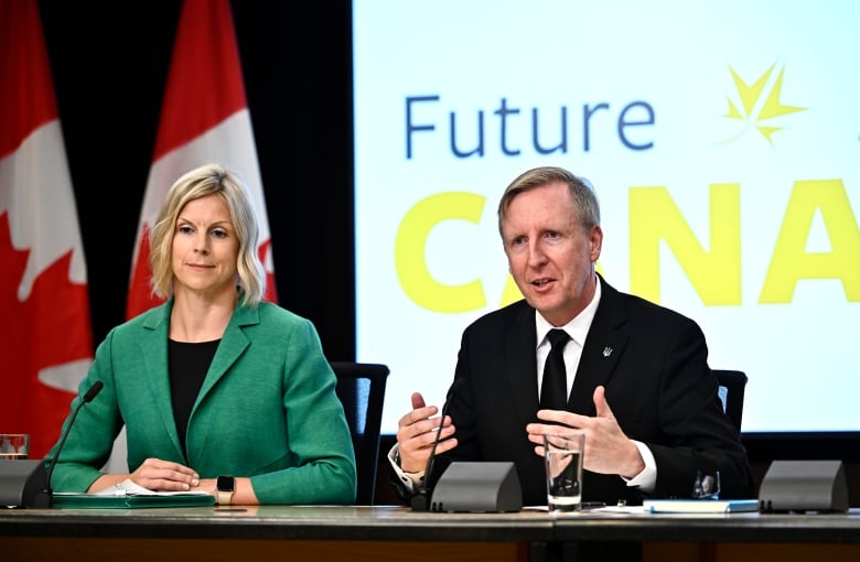 Dominic Cardy, right, interim leader of the Canadian Future Party, and Tara McPhail, interim party president, speak at a news conference launching their new federal party at the National Press Theatre in Ottawa, on Wednesday, Aug. 14, 2024.