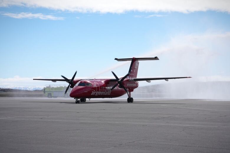 A plane that says Air Greenland on it. 