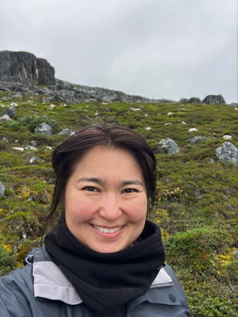 A woman takes a selfie outside in Greenland 