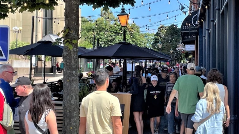 A crowd of people on Charlottetown's Victoria Row.