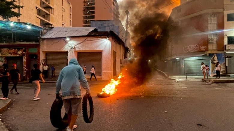 Burning tires on a street in Caracas, Venezuela.