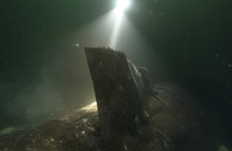 A broken gas pipe deep underwater.