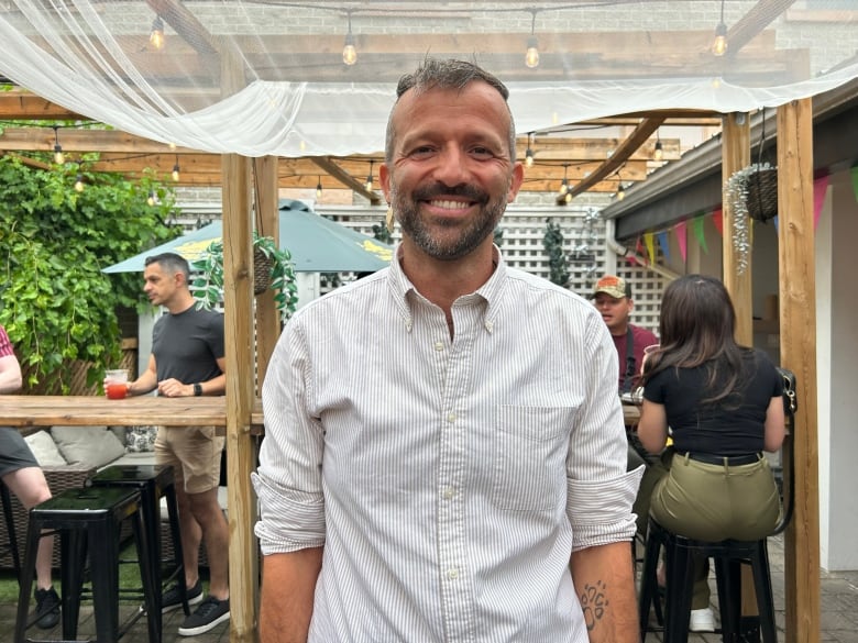 Ralph Guth stands centre frame at the Canadian Foundation for Aids Research Pride brunch and dance