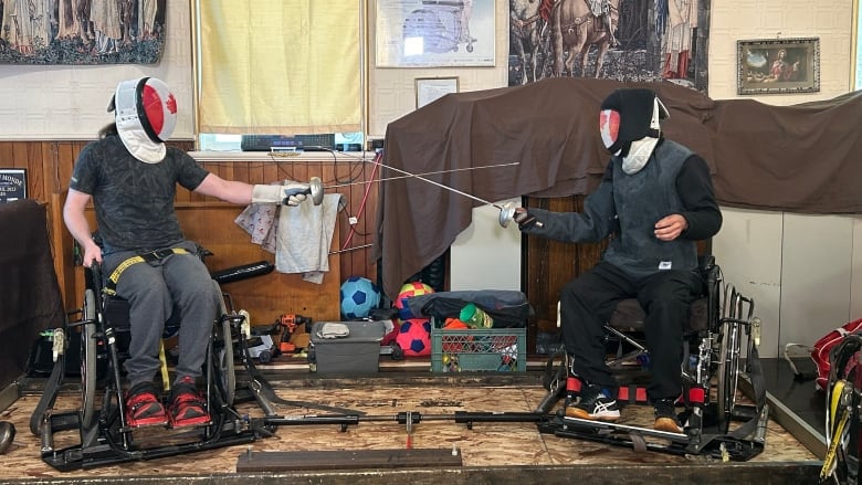 Ryan Rousell practices wheelchair fencing