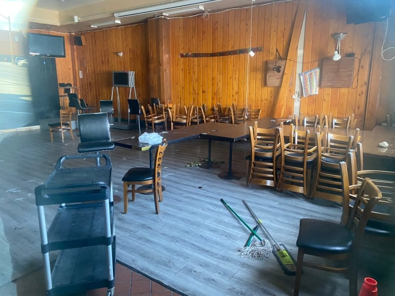 Chairs and tables sit abandoned inside the Port Pub and Hotel.