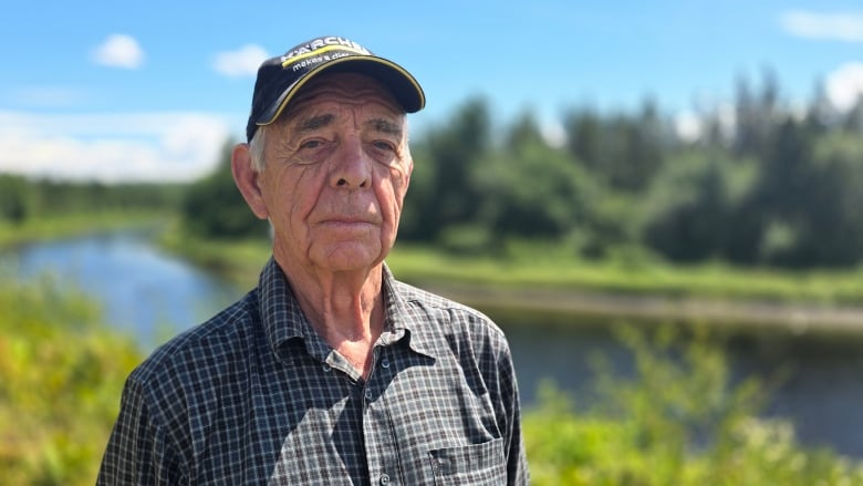 Wendell Chase standing in front of Salmon River