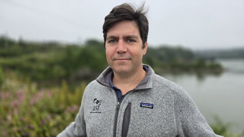 Portrait of Neville Crabbe in front of Reversing Falls in Saint John.