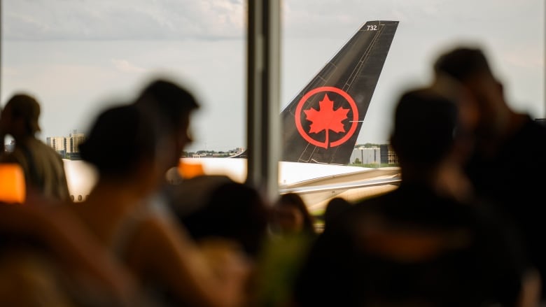 A view of an airplane from the terminal.