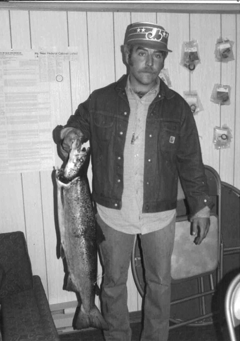 Brian Thompson stands with his 25 pound salmon.