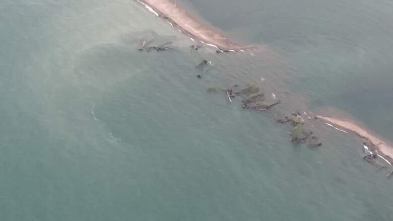 Erosion has taken its toll on a section of a beach barrier between Lake Erie and Rondeau Bay.