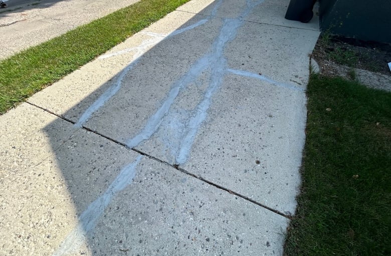 A picture of a messed up driveway.