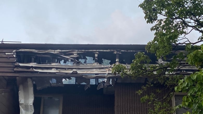 A fire-damaged building roof.