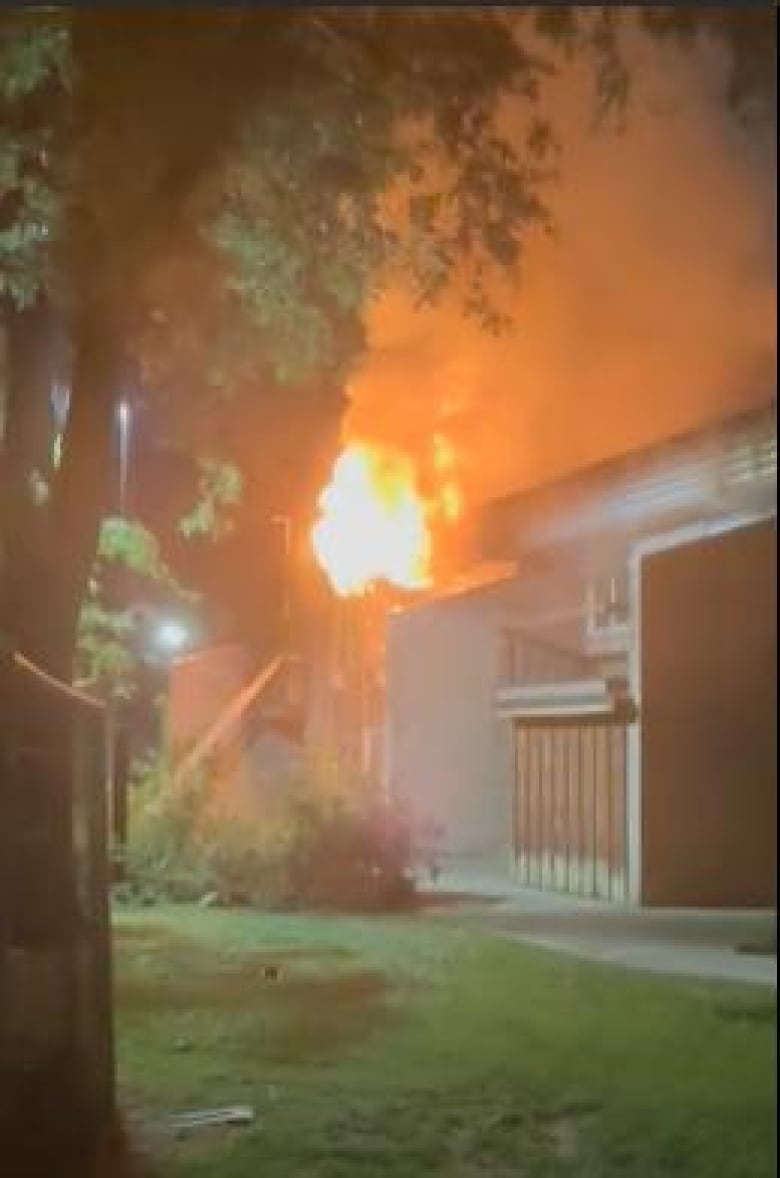 A fire burning in an apartment building.