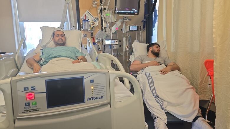 two men in hospital beds