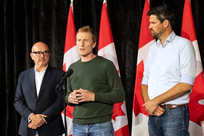 Employment Minister Randy Boissonnault, left to right, Immigration Minister Marc Miller and Housing Minister Sean Fraser speak to the media at the federal Liberal cabinet retreat in Halifax on Monday, August 26, 2024.