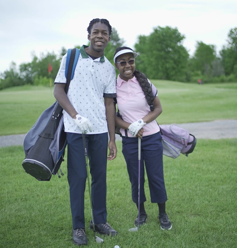 Joel and Precious Iziomon on the golf course.