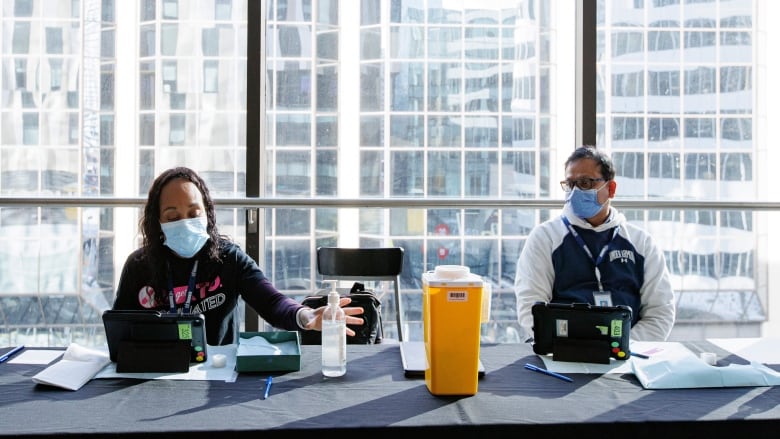 Toronto Public Health nurses hold a flu and COVID-19 vaccination clinic in winter 2023.