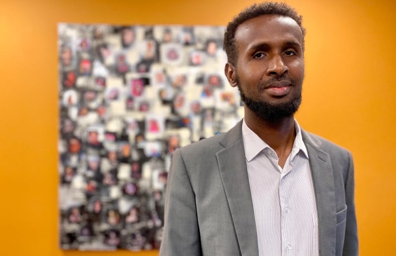 A man in a grey suit.