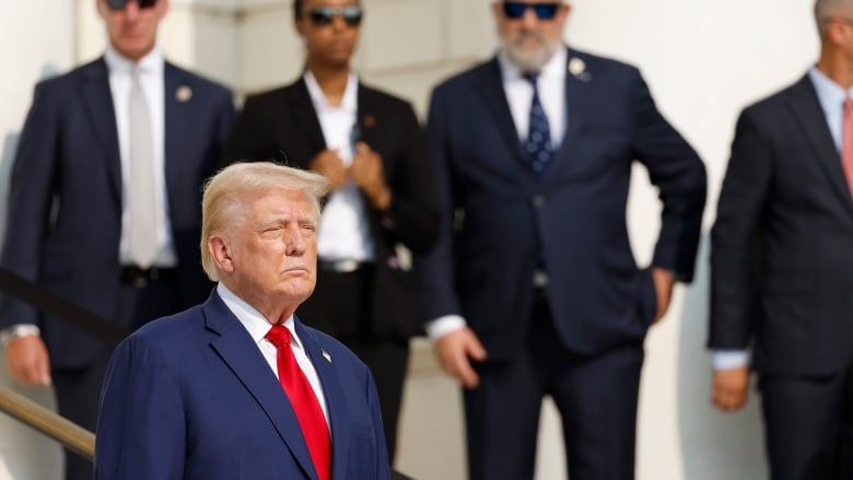 Former U.S. president Donald Trump is seen attending a wreath-laying ceremony at Arlington National Cemetery in Arlington, Va., on Monday.