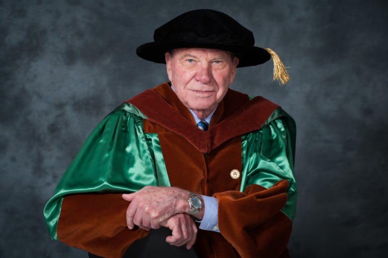 Man dressed in university garb.