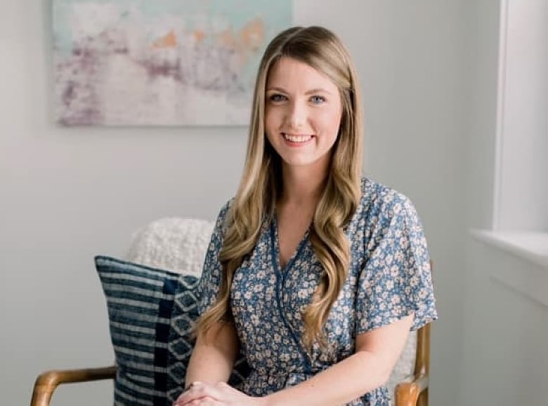 Katelyn MacLean seated near a window.