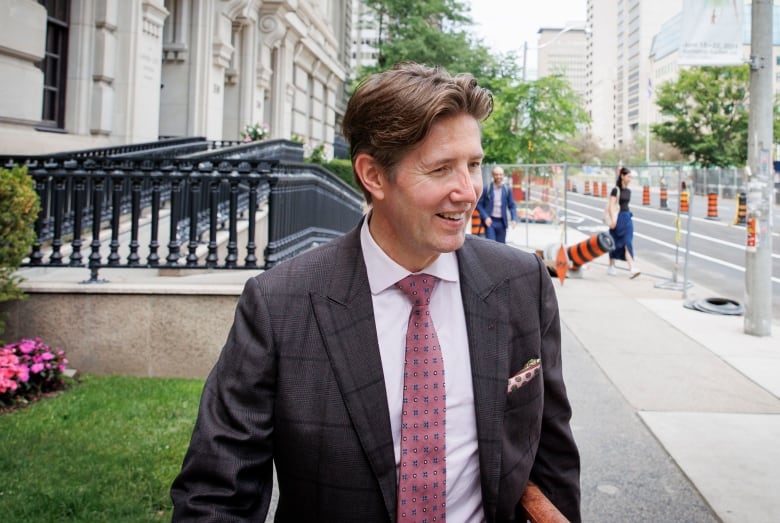 Lawyer Nicholas Cartel is seen leaving the courthouse at 330 University Avenue in Toronto on June 20, 2024.