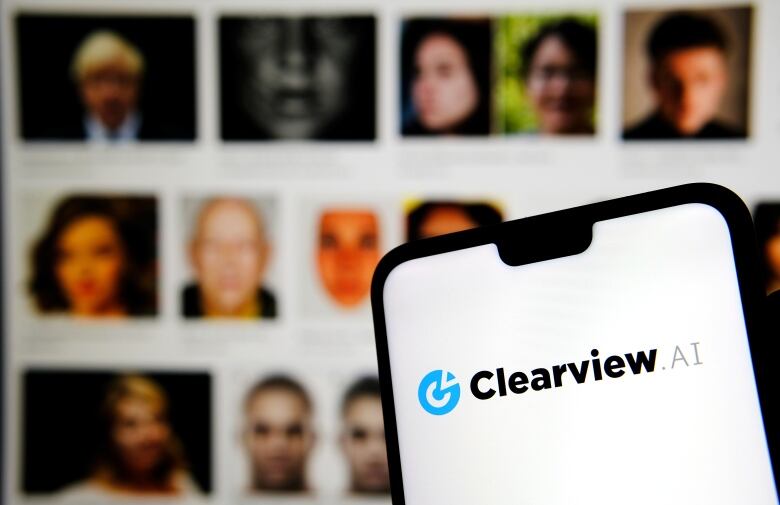 A phone with the text 'Clearview AI' is visible in front of a blurred background of faces. 