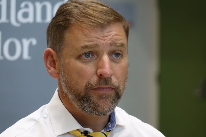 A man wearing a white dress shirt.