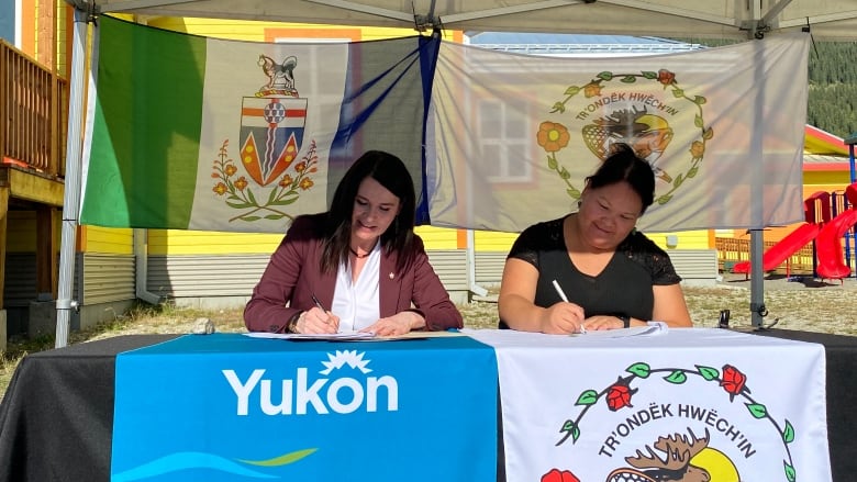 Two women sitting at a table.