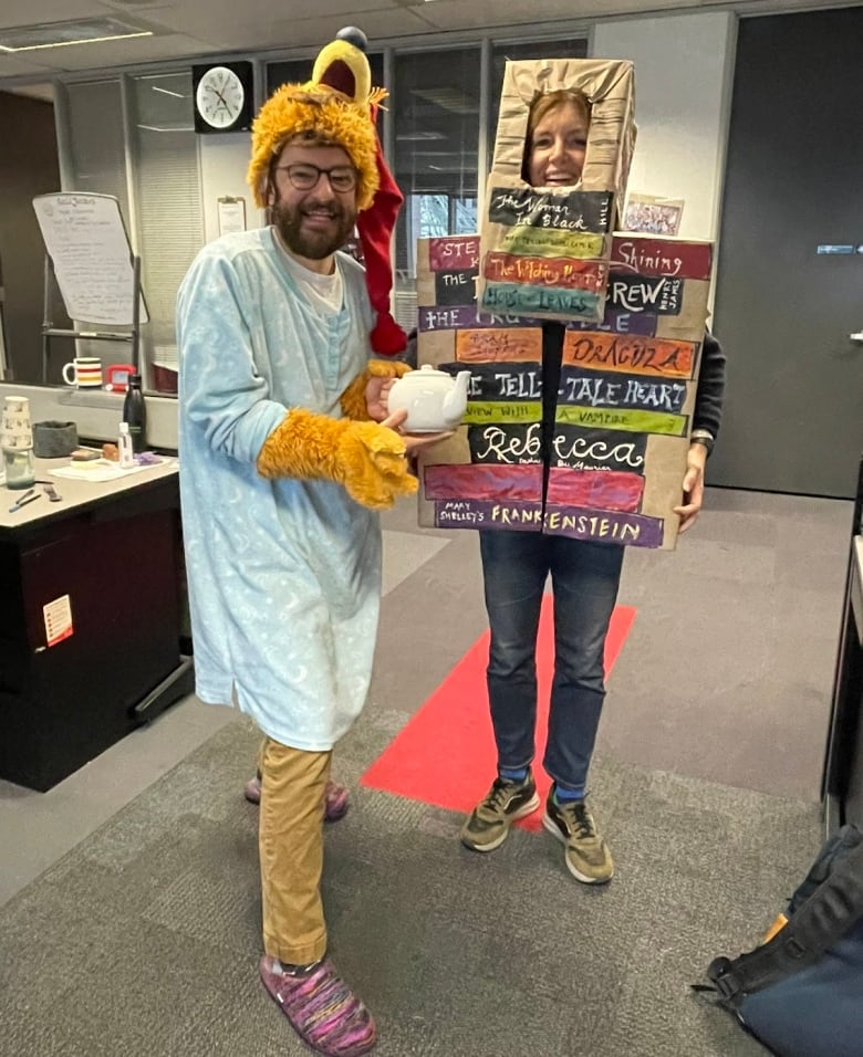 CBC Radio's Haydn Watters, left, joins Gill Deacon to dress up for Halloween while producing Here and Now. 