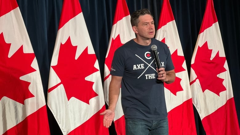 Pierre Poilievre in a t-shirt that says axe the tax