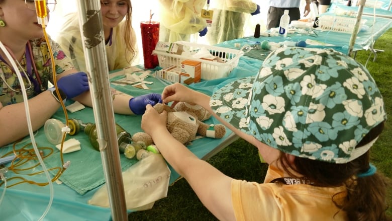 A stuffed bear gets treated. 