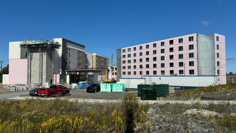 Two buildings under construction.