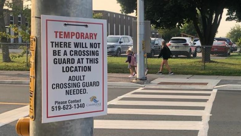 A temporary sign on a street light post