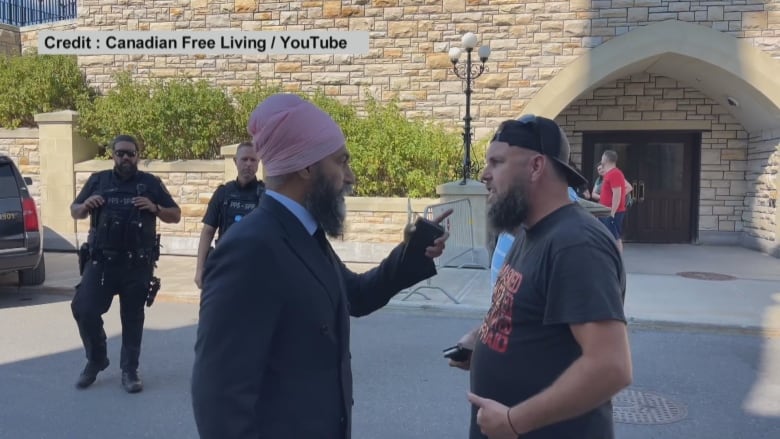 Jagmeet Singh confronts a protester on Parliament Hill after someone yelled 'corrupted bastard' at the NDP leader.