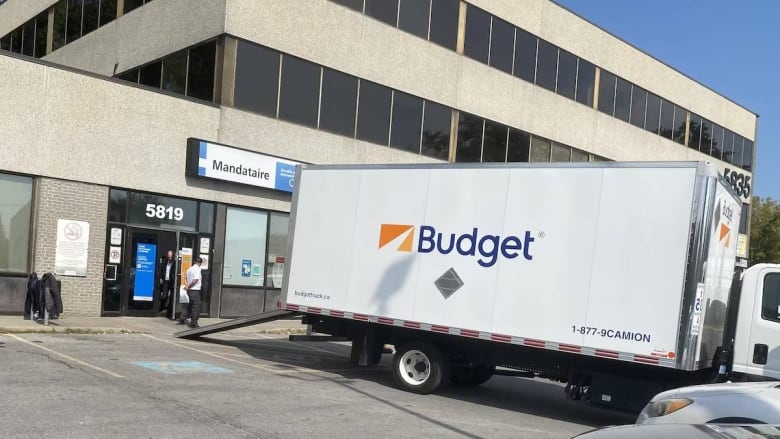 moving truck in front of building