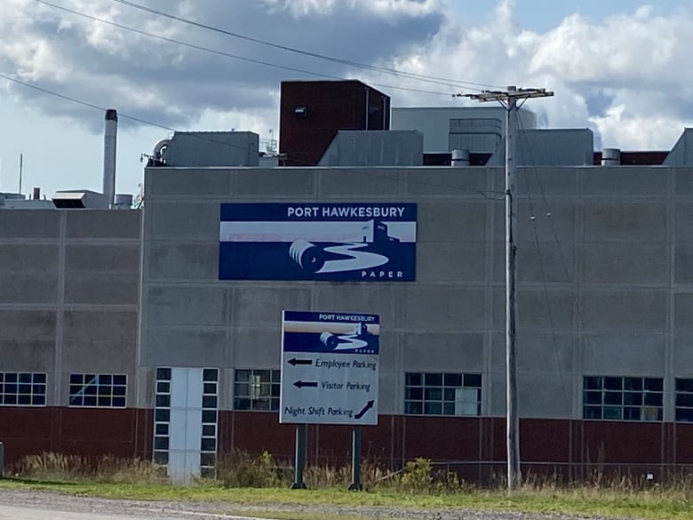 Grey building with blue sign