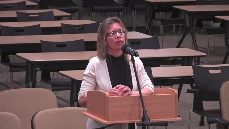 A woman at a board meeting.