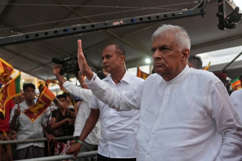 Sri Lanka's independent presidential candidate Ranil Wickremesinghe waves at an election rally.