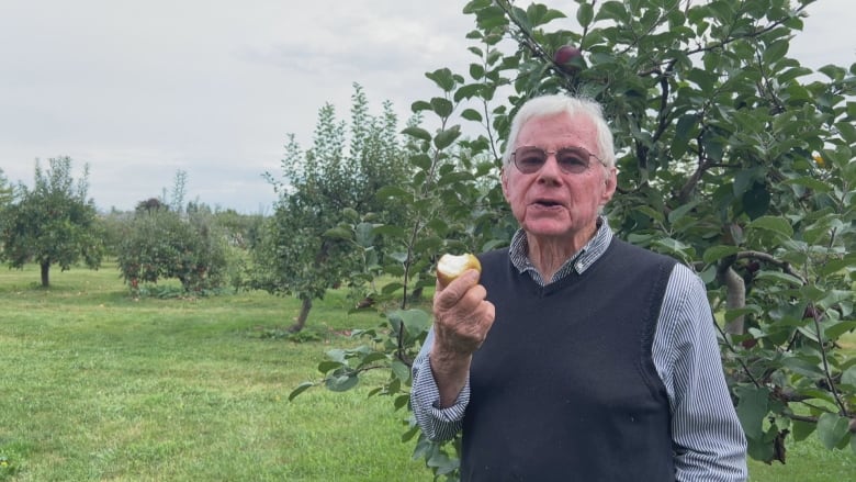 A man eats an apple