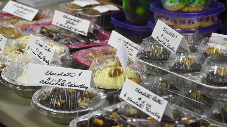 A table of baked goods with sale prices