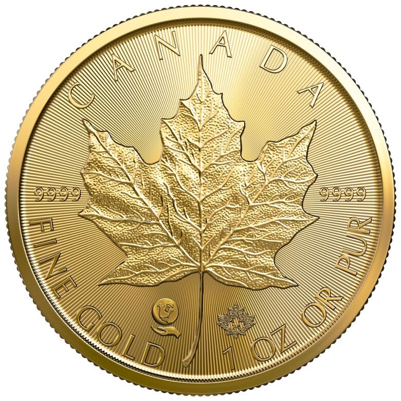 A gold coin with a maple leaf on it.