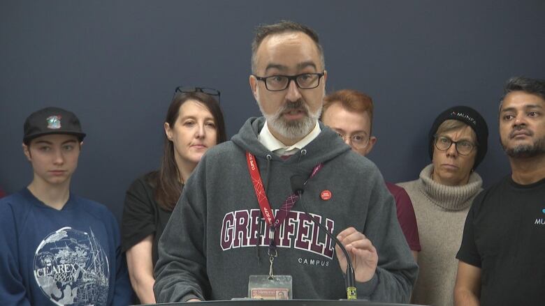 A man speaks from a podium.