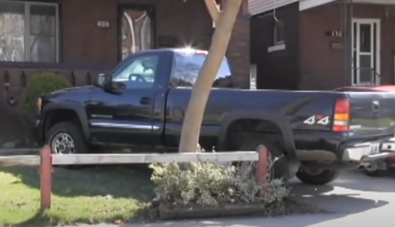 A truck parked on a lawn.