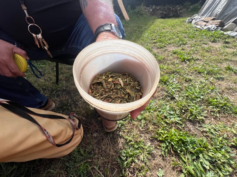 The tobacco used in pipe and fire ceremonies doesn't resemble the brown stuff you buy in the store. Michael Hopkins grows and dries his own. 