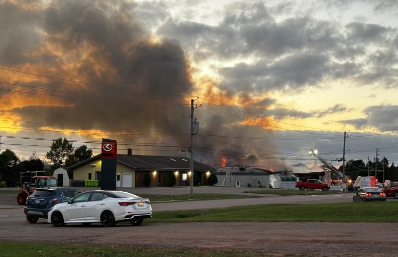 Another view of the burning Valley Truss and Metal building, located next to a veterinarian clinic. 