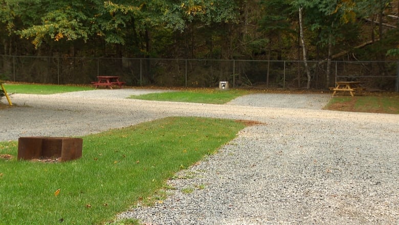 A campground with empty spots is shown. 